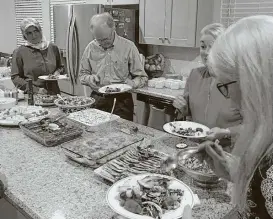  ?? Ali R. Candir ?? Congregant­s of Palmer Memorial Episcopal Church and Turkish-American Muslims share an interfaith dialogue and dinner.