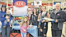  ?? DESIREE ANSTEY/ JOURNAL PIONEER ?? Deanna Doctor, with her son Jackson, from left, Mireille Bernard with parents behind the table, Tania and Gilles Bernard, Jaime Weeks with her son Nash, and Hilton MacLennan.