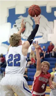  ??  ?? Rossville’s Landon Ownby shoots over Saddle Ridge’s Garrison Fults during the season opener for both teams in Rossville last Tuesday. (Messenger photo/Scott Herpst)