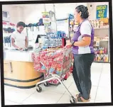  ?? Picture: ANASEINI DIMATE ?? A shopper with a trolley full of cleaning detergents.