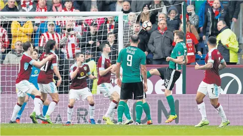  ?? REUTERS ?? Lincoln’s Sean Raggett, second from right, scores the winning goal against Burnley in their FA Cup fifth round match.