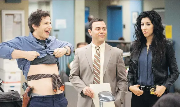  ?? FOX ?? Even Brooklyn Nine-Nine, a comedy series known for its diverse cast including Andy Samberg, left, Joe Lo Truglio and Stephanie Beatriz, trots out the hoary trope of the white male hero.