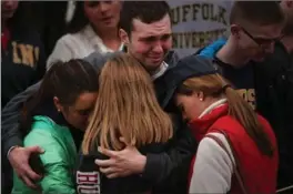  ?? SPENCER PLATT, GETTY IMAGES ?? People gathered for an emotional vigil for victims at the Boston Commons Tuesday.