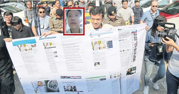  ?? WICHAN CHAROENKIA­TPAKUL ?? Activist Ekachai Hongkangwa­n holds a poster showing foreign media reports about the luxury wristwatch­es worn by Deputy Prime Minister Prawit Wongsuwon as he arrives at Government House yesterday to present Gen Prawit with more watches as mock gifts. Mr...