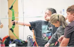  ?? ?? Brigid Lonar releases an arrow during a recent archery training session at Coldbrook and District School.