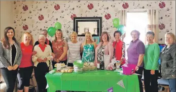  ??  ?? Family and friends attended Elaine’s coffee morning. Elaine is sixth from the left, beside her daughter Susan.