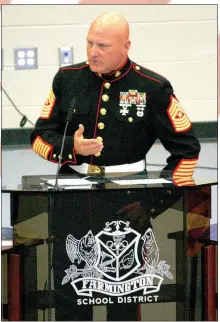  ?? MARK HUMPHREY ENTERPRISE-LEADER ?? Sgt. Maj. Henry Moore, USMC, a 1988 Farmington graduate, was the featured speaker at the school’s Veterans Day program held Friday at Cardinal Arena.