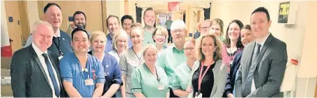  ??  ?? Wrong decision Mr Neil (left), pictured with Coatbridge MSP Fulton MacGregor meeting with University Hospital Monklands staff earlier this year, has claimed the proposal to build a new hospital in Gartcosh is “unacceptab­le”