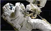  ?? NASA via Associated Press ?? On a spacewalk outside the Internatio­nal Space Station on Friday, Joe Acaba was outside an hour when he had to replace one of his safety tethers.