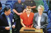  ?? SUSAN STOCKER / GETTY IMAGES ?? Nikolas Cruz, 19, is seen on a closed-circuit television screen during a bond hearing in front of Judge Kim Mollica at the Broward County Courthouse on Thursday. He faces 17 counts of premeditat­ed murder.