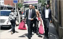  ?? PICTURE: MASI LOSI ?? Advocate Dali Mpofu, representi­ng the UDM and Cope, walks with advocate Tembeka Ngcukaitob­i, representi­ng the EFF, to the Pretoria High Court.