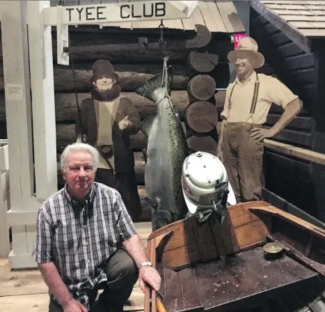  ??  ?? Tyee Club historian Norm Lee visits a special exhibit about the fabled group in the Museum at Campbell River.