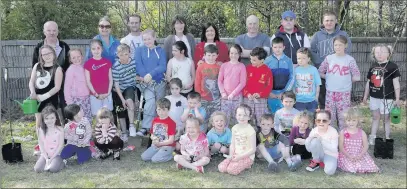  ??  ?? Youth Leaders, parents and children in the new fruit orchard in Fassaroe.