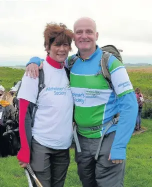  ??  ?? ●● Janet and John Thorley walked 23 miles of Hadrian’s Wall to raise funds for the Alzheimer’s Society