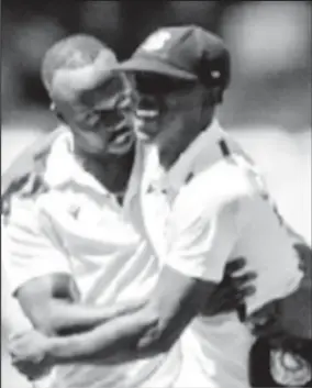  ?? ?? Fast bowler Shamar Joseph (right) celebrates with Kemar Roach on the recent tour of Australia.