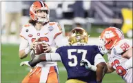  ?? Jared C. Tilton / TNS ?? Clemson quarterbac­k Trevor Lawrence looks to pass in the fourth quarter against Notre Dame during the ACC Championsh­ip game in Charlotte, N.C., on Saturday.