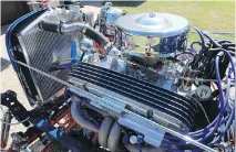  ??  ?? Powering the rod is a Ken Gilmour-built small-block 283, backed up by a two-speed Powerglide automatic transmissi­on.