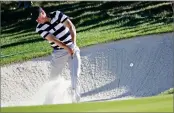  ?? AP PHOTO BY JULIO CORTEZ ?? Jordan Spieth hits from a sand trap on the 11th hole during the Presidents Cup foursomes golf matches at Liberty National Golf Club in Jersey City, N.J., Thursday.