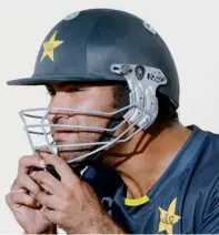  ?? AFP ?? Pakistan’s batsman Sohaib Maqsood adjusts his helmet during a net practice session in Sharjah. —