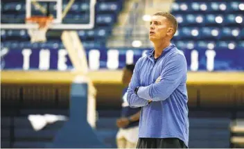  ?? K.C. ALFRED U-T ?? University of San Diego basketball coach Sam Sholl runs a drill during a practice on Oct. 17, 2019.