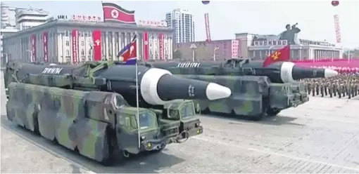  ?? KRT VIA AP ?? Missiles are paraded through a square in Pyongyang, North Korea, on Saturday during a weekend of heightened tension with the United States.