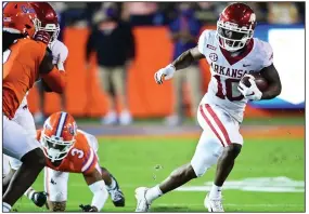  ?? (University of Arkansas photo/Walt Beazley) ?? Arkansas receiver De’Vion Warren (right) tore a ligament in his knee in Saturday night’s loss at Florida and will miss the remainder of the season, Razorbacks Coach Sam Pittman announced Monday.