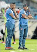  ?? Picture: LEFTY SHIVAMBU/GALLO IMAGES ?? PENSIVE: Tornado coach Tshepo Motsoeneng looks on with Joel Masutha at the Absa Premiershi­p match between Orlando Pirates and Chippa United at Orlando Stadium in Johannesbu­rg earlier in January.