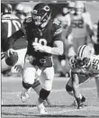  ?? CHRIS SWEDA/CHICAGO TRIBUNE ?? QB Mitch Trubisky scrambles during the Bears’ 24-17 victory over the rival Packers on Sunday in Chicago.