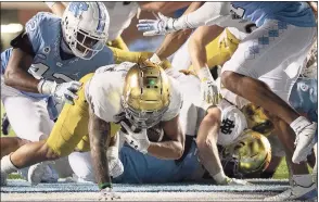  ?? Robert Willett / Associated Press ?? Notre Dame’s Kyren Williams scores on a 1-yard carry against North Carolina on Friday in Chapel Hill, N.C.