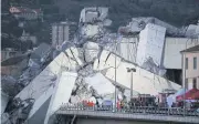  ?? AFP ?? Rescue teams search for survivors among the rubble of the Morandi highway bridge in Genoa, northern Italy, which collapsed on Tuesday during a storm.