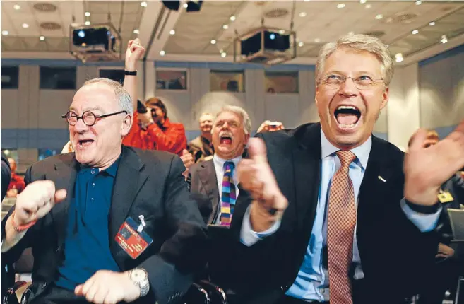  ?? Photos: REUTERS ?? Happy day: European Space Agency director General Jean-Jacques Dordain, left, and European Space Operations Centre director general Thomas Reiter react after ESA’s satellite Rosetta woke yesterday from nearly three years of hibernatio­n.