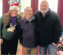  ??  ?? David Lonsdale, right, with Mike and Gillian from Stepping Stones at their Christmas fair