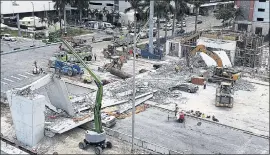  ?? PEDRO PORTAL — MIAMI HERALD VIA AP ?? Recovery operations continue Saturday at the site of the Florida Internatio­nal University­Sweetwater University bridge in the Miami area that collapsed earlier in the week.