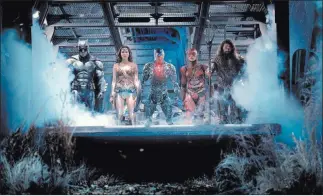  ?? Clay Enos ?? Warner Bros. Batman (Ben Affleck), Wonder Woman (Gal Gadot), Cyborg (Ray Fisher), the Flash (Ezra Miller) and Aquaman (Jason Momoa) in the superhero mashup “Justice League,” which opens Friday.