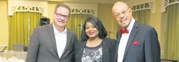  ??  ?? From left: Dr Roger Asencio, chief medical underwrite­r at Morgan White Intl, Kiri Brown from Morgan White Intl, and A. Patrick Lawe, president of Lawe Insurance Brokers, pose for the camera at the conclusion of the awards ceremony.