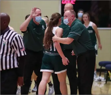  ?? TIM PHILLIS — FOR THE NEWS-HERALD ?? The Elyria Catholic bench celebrates during the Panthers’ victory over host Cornerston­e Christian on Nov. 24.