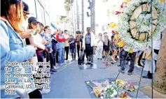  ??  ?? People gather around the star of Lee on the Hollywood Walk of Fame in Los Angeles, California, US, Nov 12, 2018.