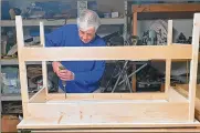  ?? CONTRIBUTE­D ?? Air Force veteran Jim Lemanek builds desks for children learning remotely during the pandemic.