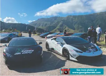  ?? ?? The owners of the stunning Lamborghin­is enjoying the lovely vistas in the Outeniqua Pass.