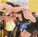  ?? Dave Stewart/Hearst Connecticu­t Media ?? Norwalk’s Brendan Gilchrist wrestles East Hartford’s Sammy Montovani in the 195-pound final at the CIAC Class LL tournament in Trumbull on Saturday.