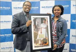  ?? Picture: SIBONGILE NGALWA ?? SOUND OF SUCCESS: Zahara stopped off at the Daily Dispatch offices to present editor Bongani Siqoko with a framed copy of her third album ‘Country Girl’, which has gone platinum in just a month