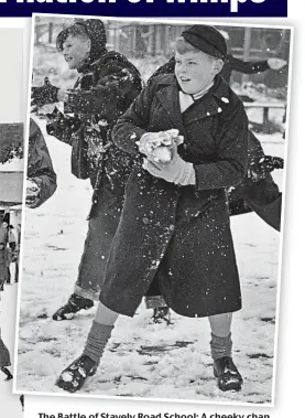  ??  ?? The Battle of Stavely Road School: A cheeky chap from Chiswick, West London, takes aim in 1958
