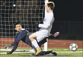  ?? Gregory Vasil / For Hearst Connecticu­t Media ?? Bassick goalkeeper Gustavo Poblano makes a save against Avon during a Class L quarterfin­al game on Saturday at Harding High School in Bridgeport.