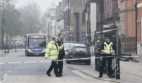  ??  ?? A police cordon on Broadway