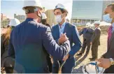  ?? COURANT FILE ?? Hartford Councilman Jimmy Sanchez, left, and developer Randy Salvatore of RMS Cos. shake hands after a ceremonial groundbrea­king in October 2020 for 270 apartments, a 300plus space parking garage and 11,000 square feet of retail space across from Dunkin’ Donuts Park.