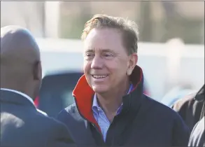  ?? Tyler Sizemore / Hearst Connecticu­t Media ?? Gov. Ned Lamont chats before publicly speaking about the new overpass being built spanning I-95’s Exit 9 in Stamford on Monday.