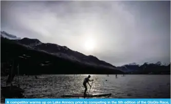  ??  ?? A competitor warms up on Lake Annecy prior to competing in the 5th edition of the GlaGla Race, a race of some 300 paddlers competing on icy waters off Talloires, in the Auvergne-Rhone-Alpes region of southeaste­rn France yesterday. — AFP