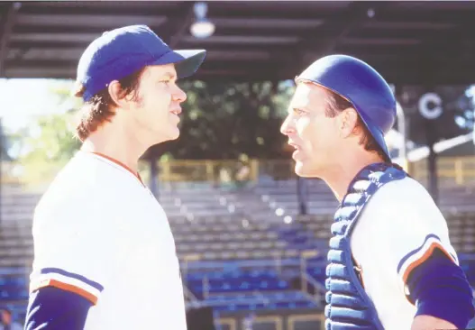  ??  ?? It’s been 20 years since Bull Durham — starring Tim Robbins and Kevin Costner as teammates and Susan Sarandon as a devoted fan — reintroduc­ed moviegoers to minor-league baseball and ballpark promotions such as the movie’s “Hit bull, win steak” sign. Bull Durham leads off Steve Simmons’s list of the greatest sports films of all time.