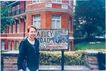  ??  ?? The author with the Abbey Road sign with graffiti autographs from Beatles fans.