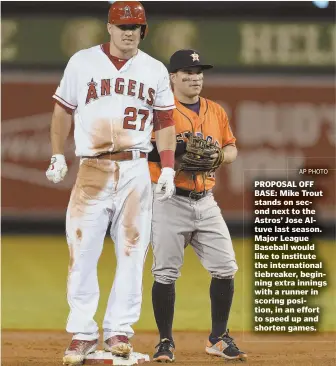  ?? APPhoTo ?? PROPOSAL OFF BASE: Mike Trout stands on second next to the Astros’ Jose Altuve last season. Major League Baseball would like to institute the internatio­nal tiebreaker, beginning extra innings with a runner in scoring position, in an effort to speed up...
